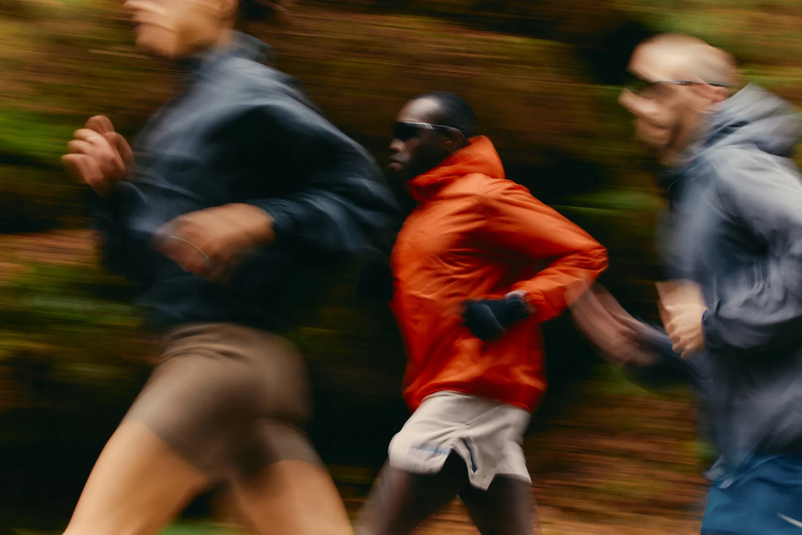 Runners in motion on a forest trail